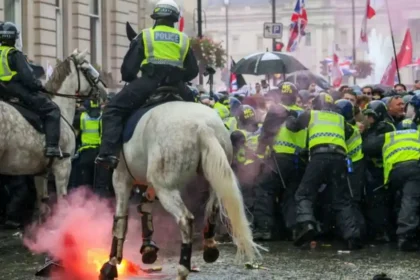 Elon Musk’s speech at the Unite the Kingdom march triggers outrage as violence erupts in London, leaving police officers injured.