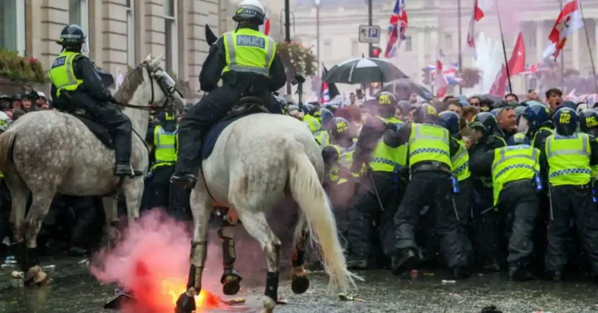 Elon Musk’s speech at the Unite the Kingdom march triggers outrage as violence erupts in London, leaving police officers injured.